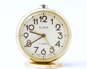 Vintage Russian mechanical alarm clock Slava from Soviet Union period green clock