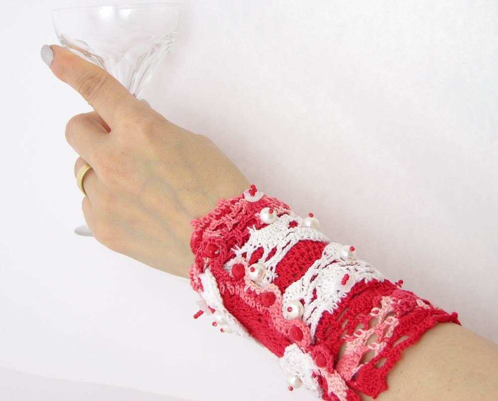 arm cuff crocheted with pearls red pink blend white beaded embroidered crochet lace tagt team curationnation