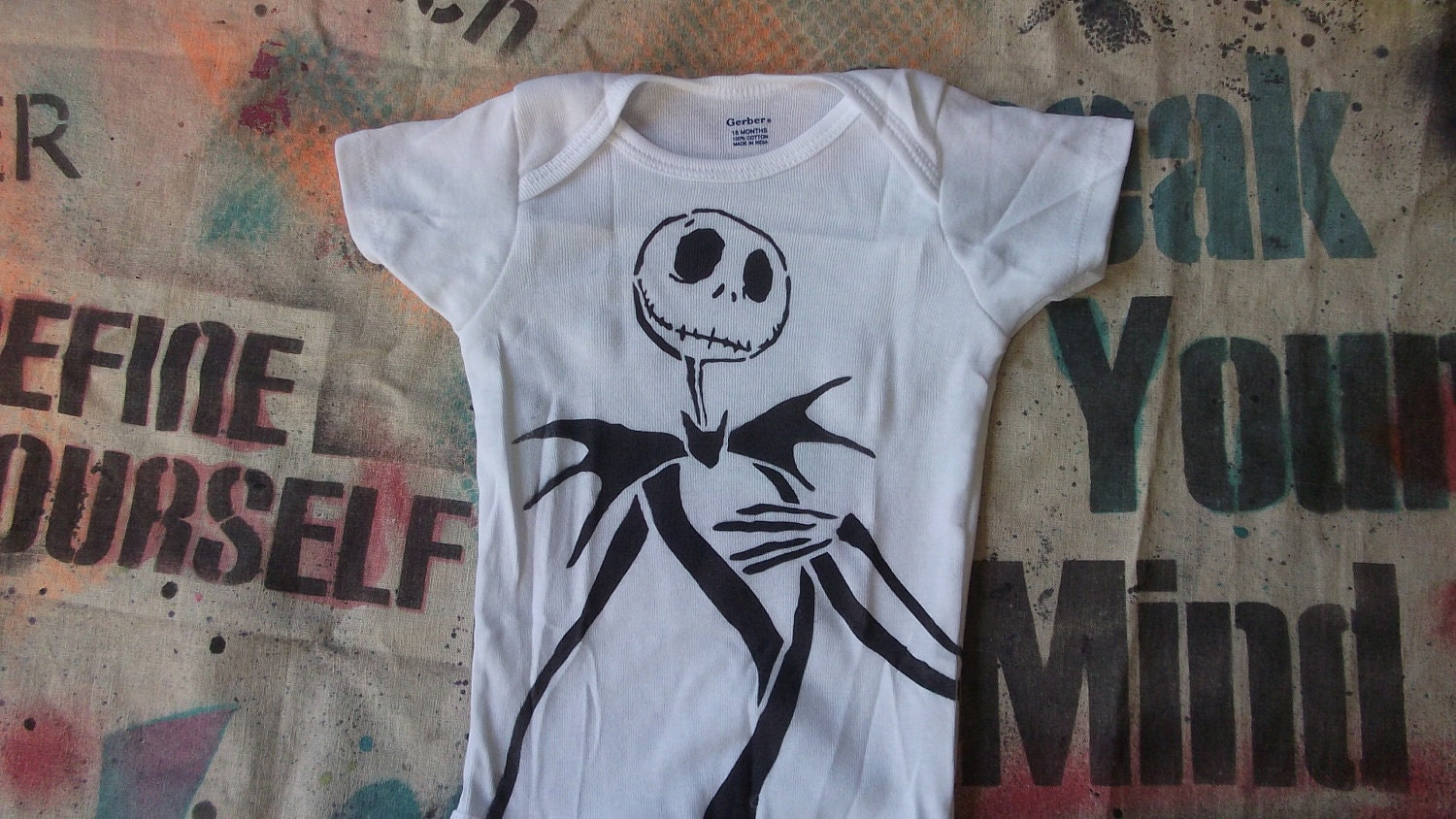 cute baby onesie Jack Skellington Nightmare Before Christmas hand stenciled and spray painted by Rainbow Alternative on Etsy