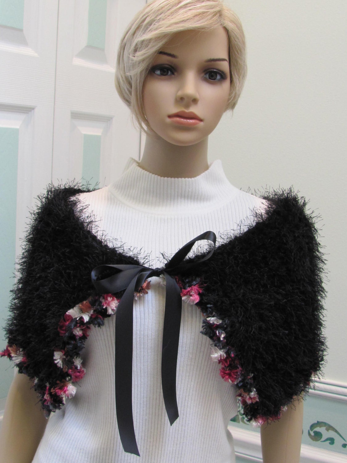 Caplette,shawl,hand knitted in black fun fur ,with eyelash ribbon yarn trim in pink shades