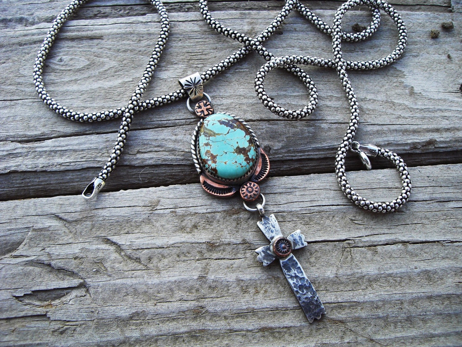 Turquoise pendant with hanging cross in sterling silver