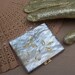 Vintage powder compact mother of pearl effect Lucite unused 1960s (K)