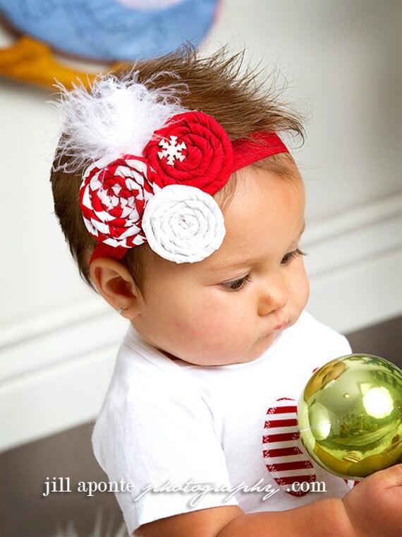 Red and white rolled fabric rosette w/white feathers newborn baby infant girl toddler on a red shimmery elastic headband
