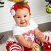 Red and white rolled fabric rosette w/white feathers newborn baby infant girl toddler on a red shimmery elastic headband