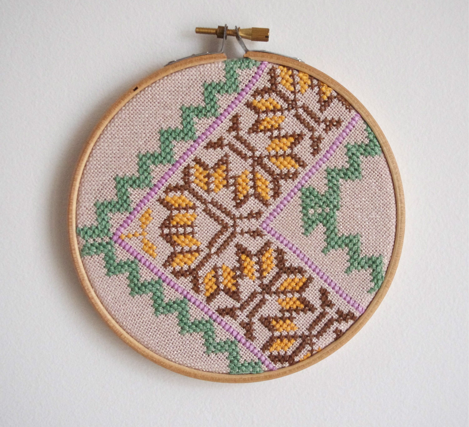 Pair of vintage embroidered zig zag wall art hoops