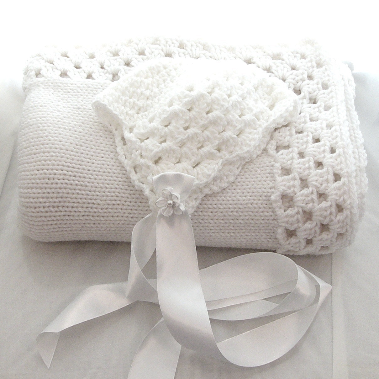 White Knitted Baby Blanket with Granny Square Edge and Baby Hat Satin Ribbon
