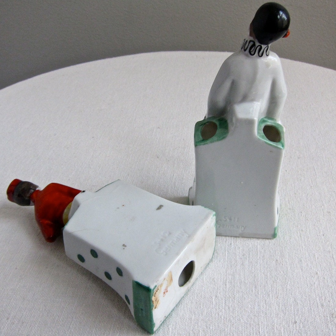 Two German Porcelain Figures of a Clown and a Bellhop, 1930s