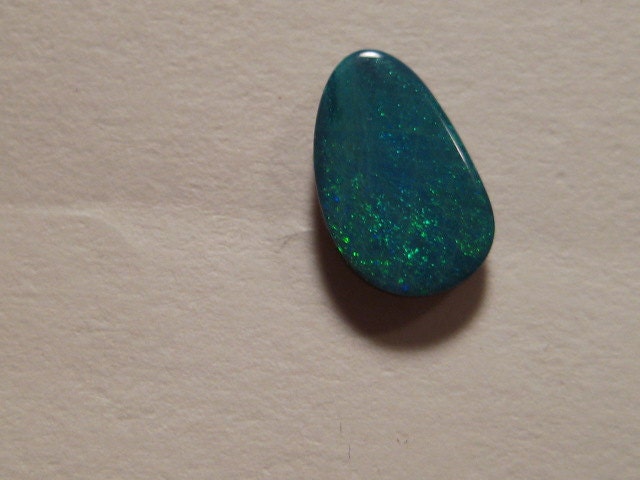 Australian Boulder Opal doublet ......... 9 x 6 x 2 mm thick .. 670