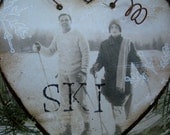Fetching Vintage Couple Snow Skiing - Rusty Tin Heart - Vintage Ski Ornament