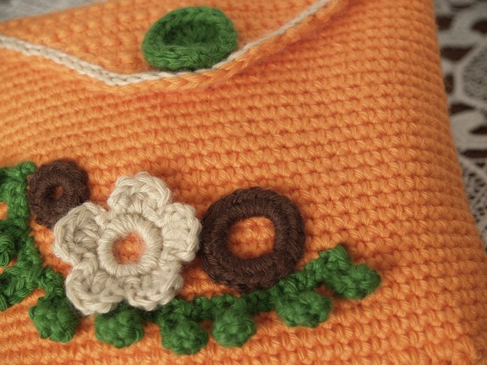 Orange crochet pouch with brown and beige flowers