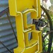 vintage yellow metal salvaged neon sign letter E