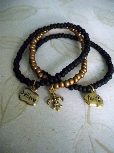 Set of Black and Gold Saints Charm Bracelets