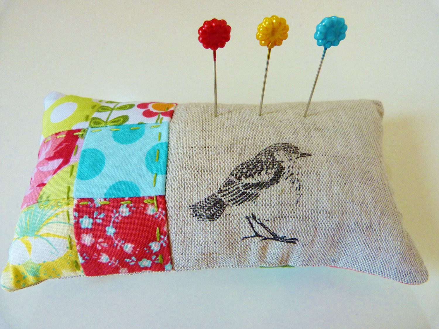 Pincushion in red, green, yellow and aqua patchwork with linen in a bird theme READY TO SHIP