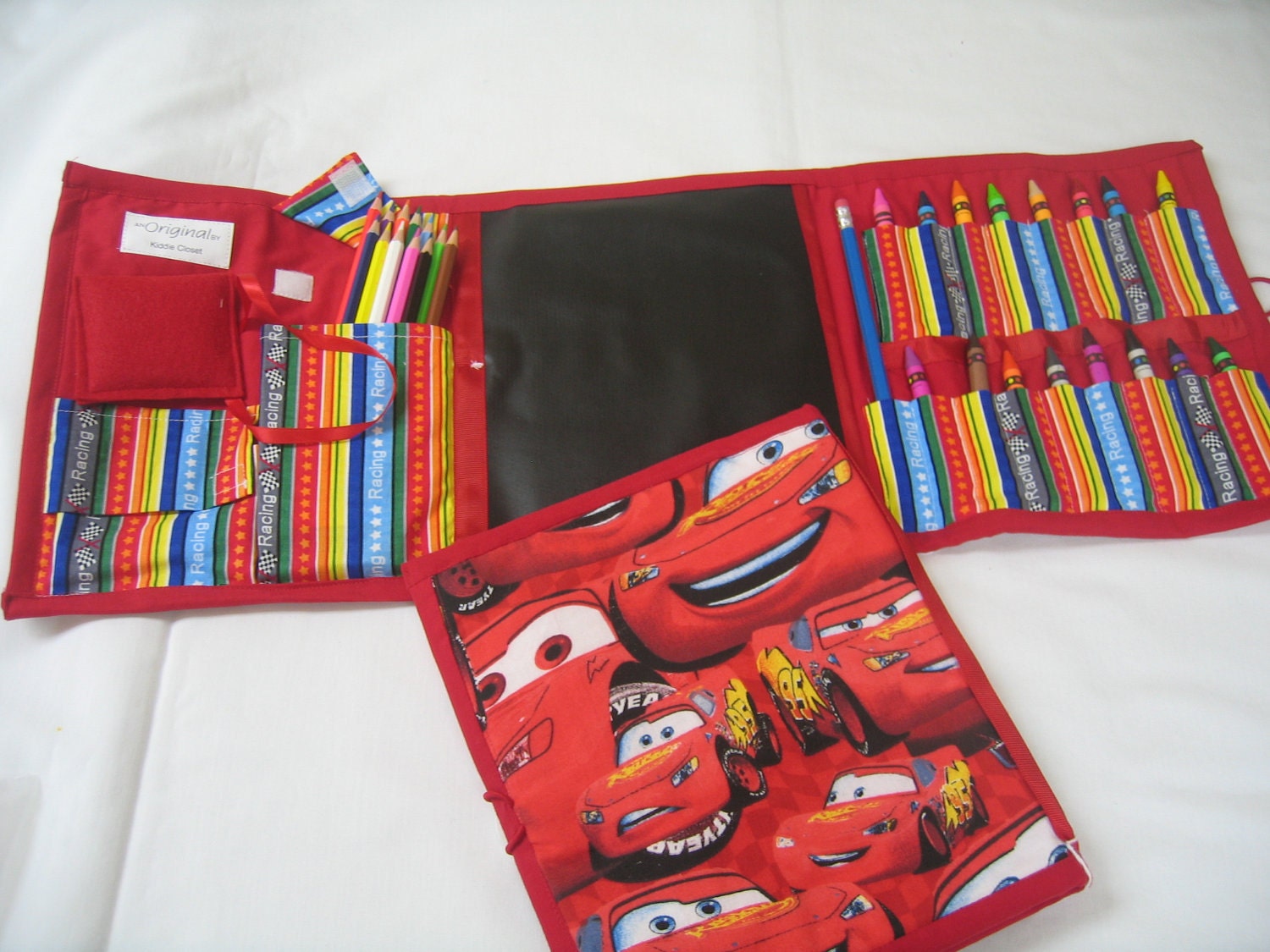 Red Lightning McQueen Art Tote complete with chalkboard, chalk, eraser, paper pad, pencil, crayons, and colored pencils