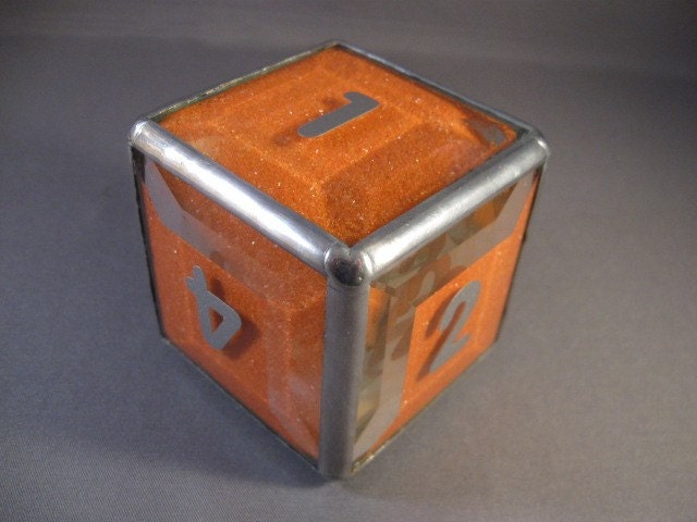 d6 paperweight in beveled glass filled with colored sand
