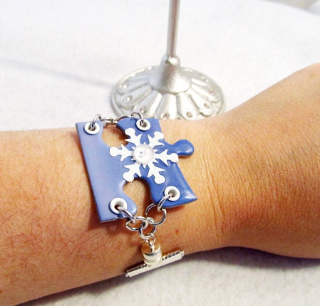 Puzzle Bracelet with white snowflake and silver ribbon band