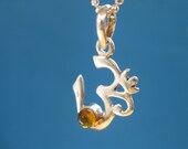 OM with an Amber stone The Seat of life chakra