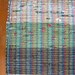 Green Upcycled Rug Woven from Plastic Grocery Bags.