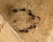 Beaded leather with copper heart bracelet.