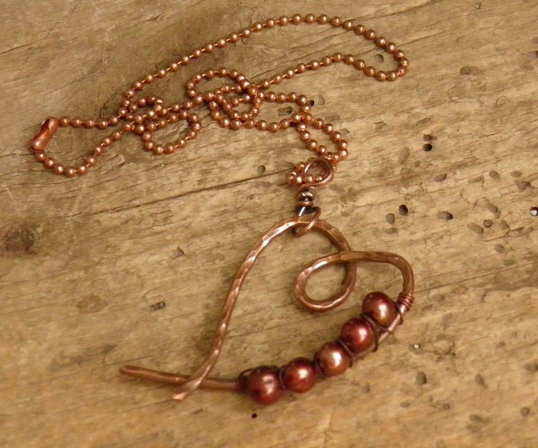 Copper heart necklace with pearls.
