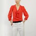 Orange silk blouse with bowtie