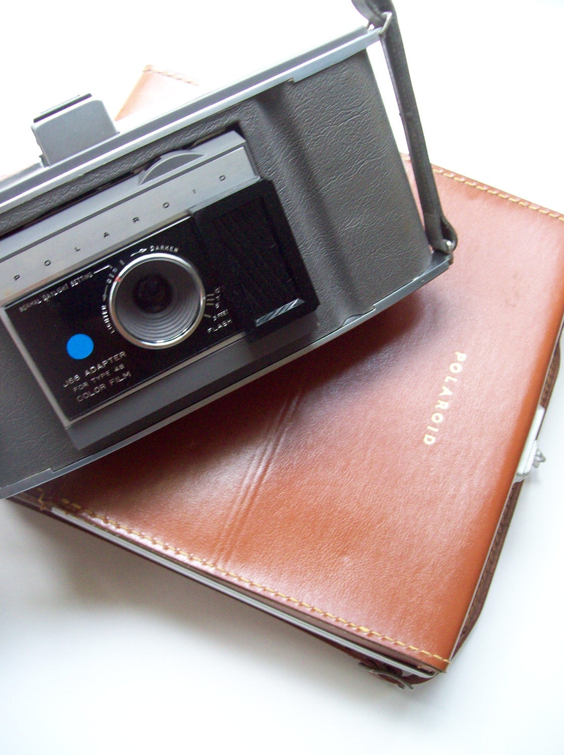 Polaroid land camera with case and extras