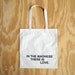 in the madness, there is love tote bag - black text