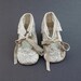 Baby shoes from lace-covered beige leather