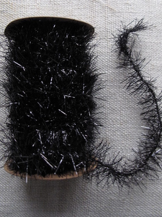 items similar to spool of black tinsel trim garland items similar to spool of black tinsel trim garland