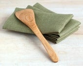 Kitchen set. Linen napkins with kitchen wooden shovel.