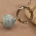 Large blue larimar smooth round bead pendant on large sterling silver hammered ring