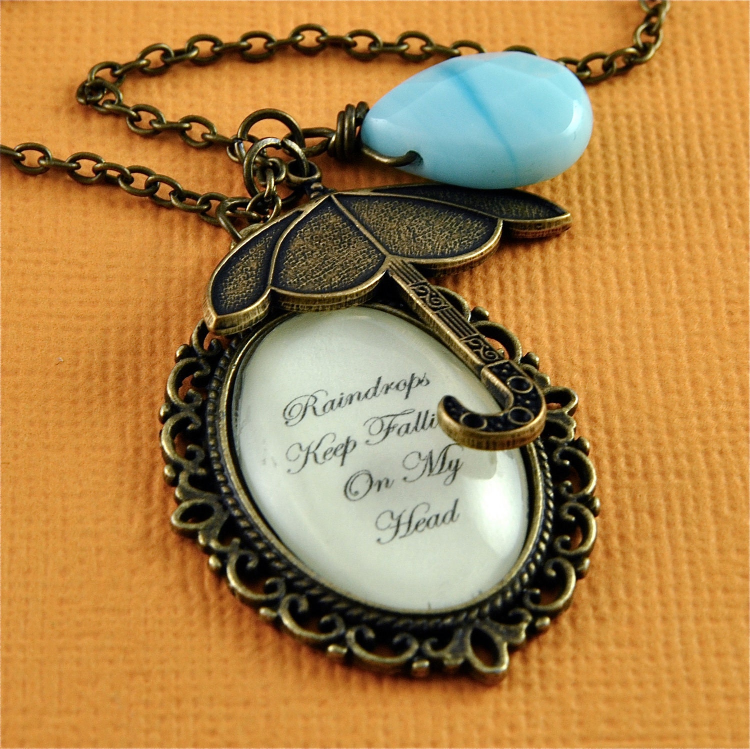 Raindrops Keep Falling - Bronze Cream and Blue Umbrella Cameo Necklace with Teardrop Accent