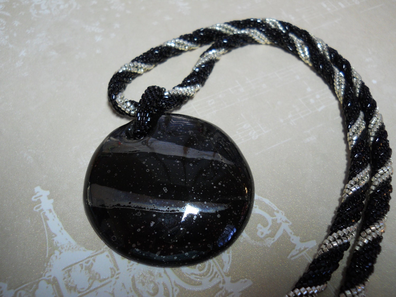 Kazuri black and silver pendant with beaded rope