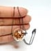 Copper glitter necklace in round hand blown glass necklace