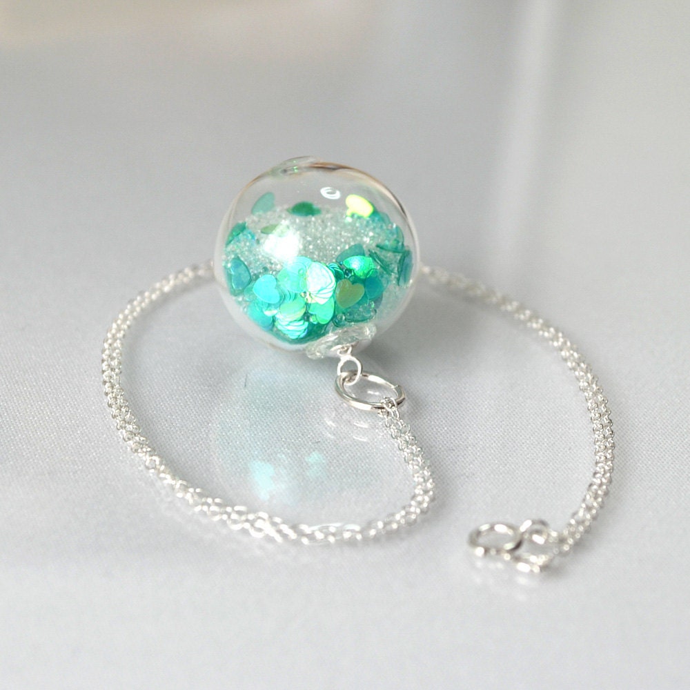 Icy teal heart glitter in blown glass ball silver necklace