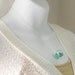 Icy teal heart glitter in blown glass ball silver necklace