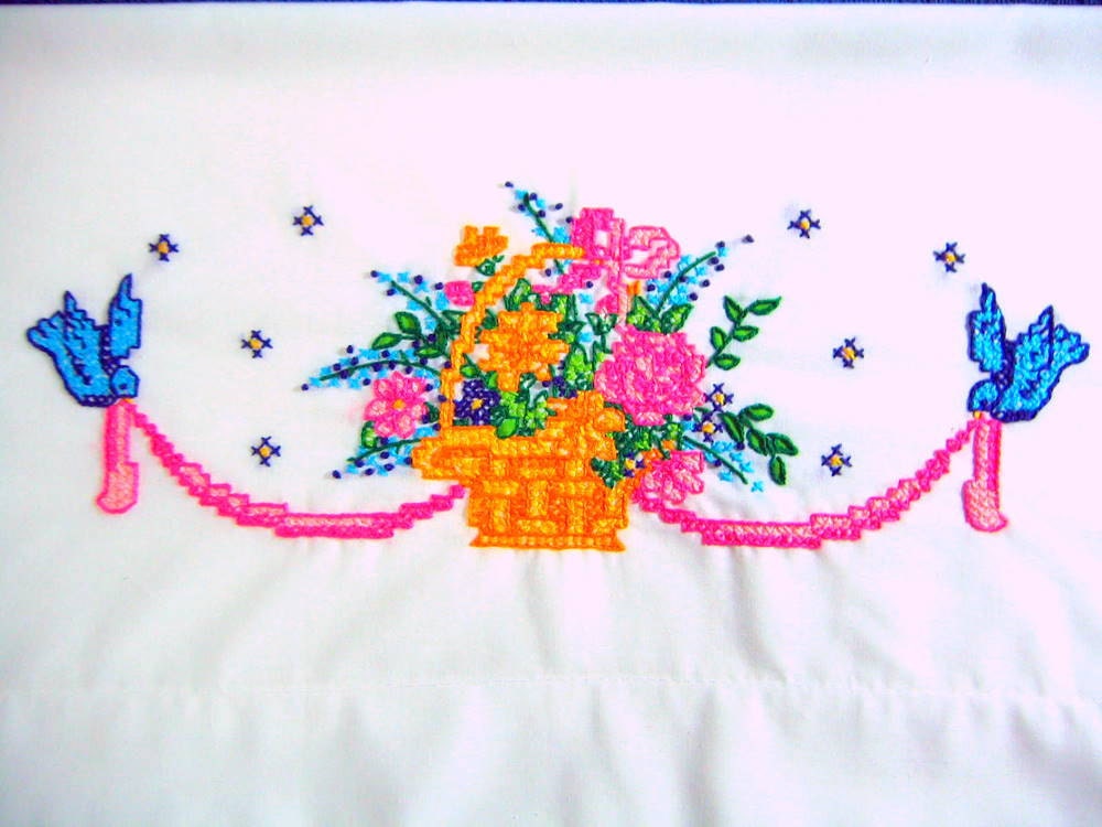 2 Q. pillowcases with a basket of flowers and blue birds