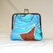Cotton Rose Palm Clutch in blues, turquoise, and brown