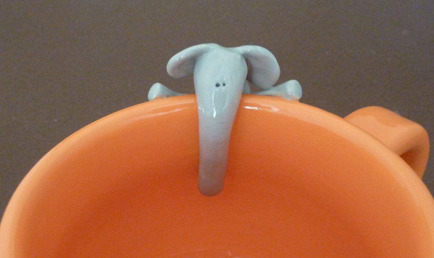 Orange mug with elephant