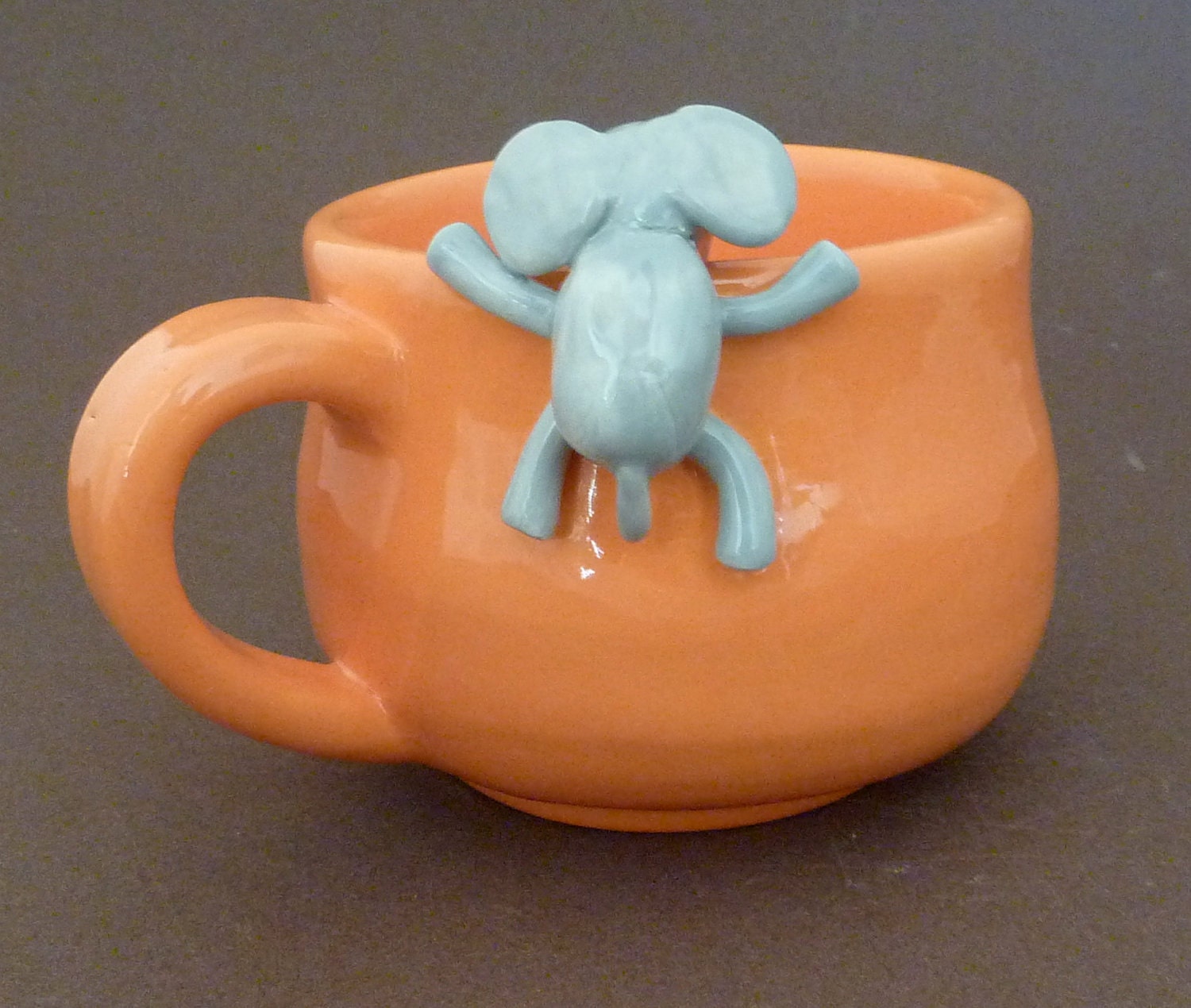 Orange mug with elephant
