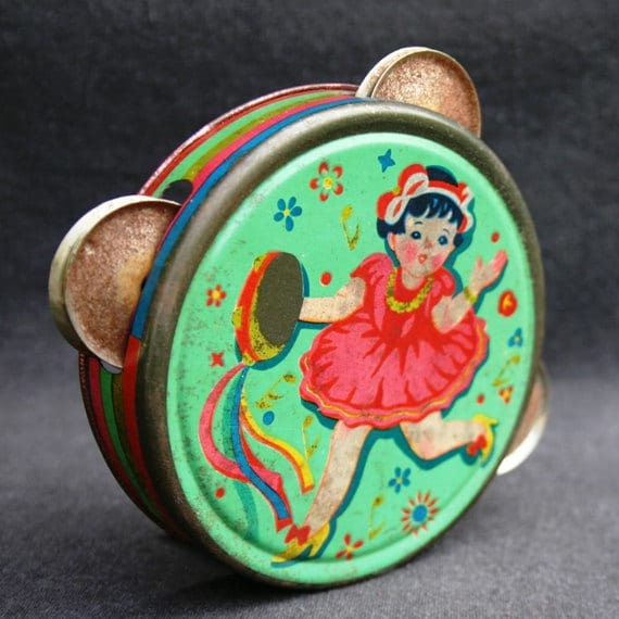 Fun colorful tambourine. Vintage collectible toy.
