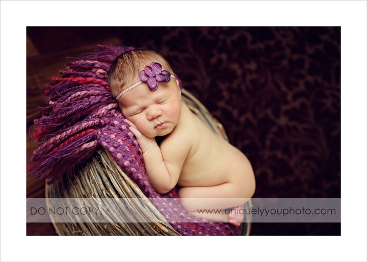 Small purple flower on a skinny elastic headband