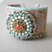 Celadon green medallion ribbon leather and swarovski wide cuff