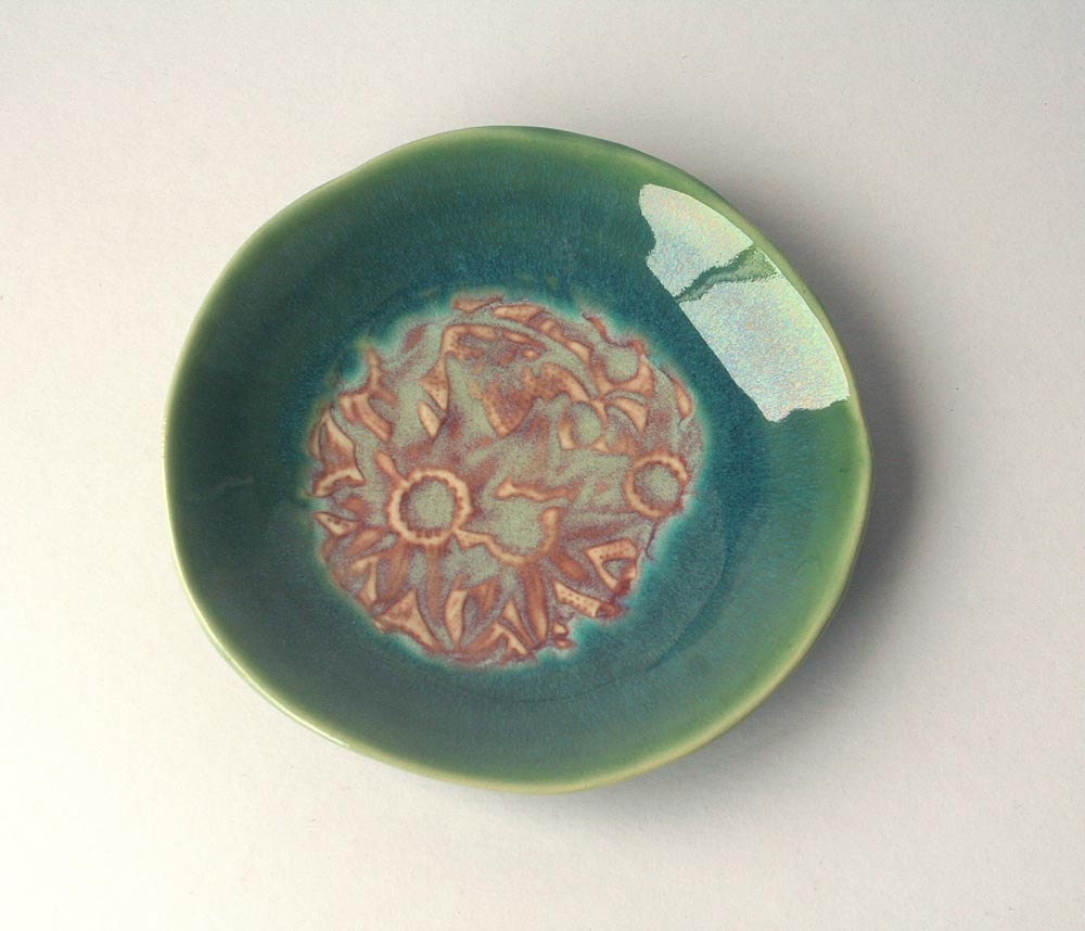 Stoneware Plate with Australian flannel flowers. Green and red food safe glazes