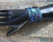 Blue and purple bracelet with blue, purple, and teal vintage buttons