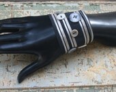 Black and grey striped bracelet with black and grey vintage buttons