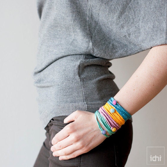 Crochet Bracelet . Blue with pink button .