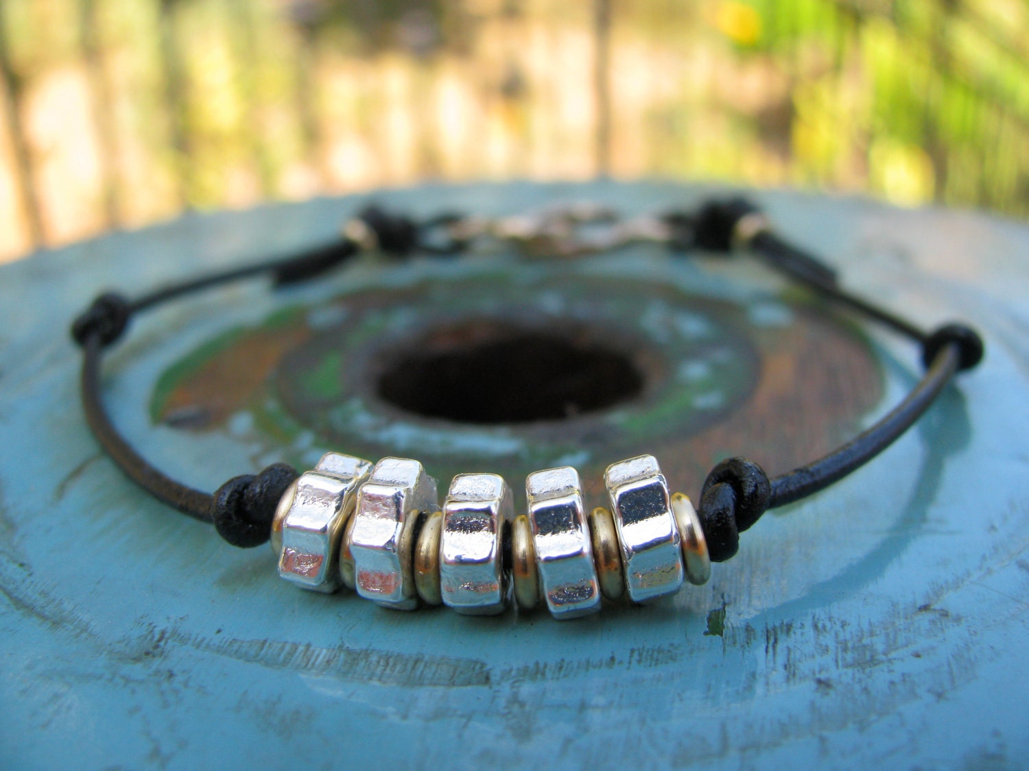 Handmade Black Greek Leather Bracelet with Metallic Silver and Gold Ceramic Beads and a Bronze Clasp