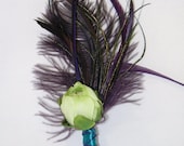 Purple Feather Boutonniere with green rananculus bud