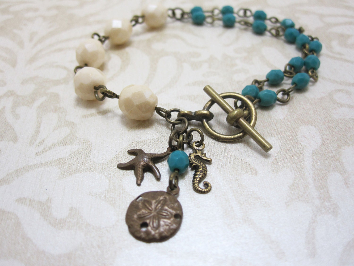 Beach Bracelet - Ivory and Turquoise Glass Beaded Starfish, Sand Dollar and Seahorse Bracelet
